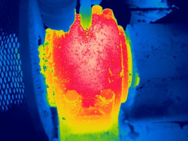 Thermal image of an overheating bearing housing glowing red