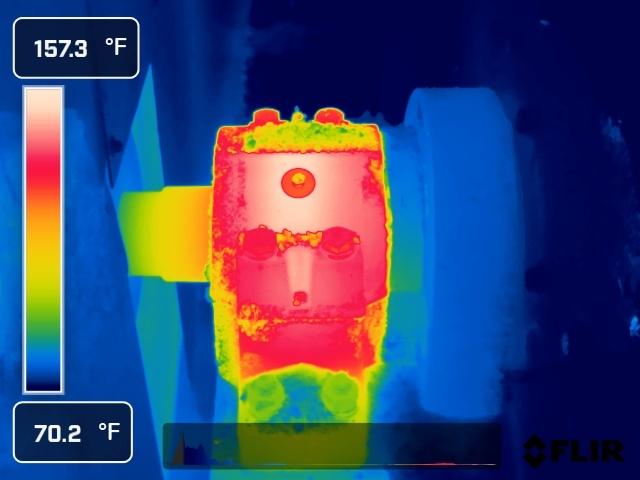 Thermal image of the same bearing housing showing elevated temperature at 157°F