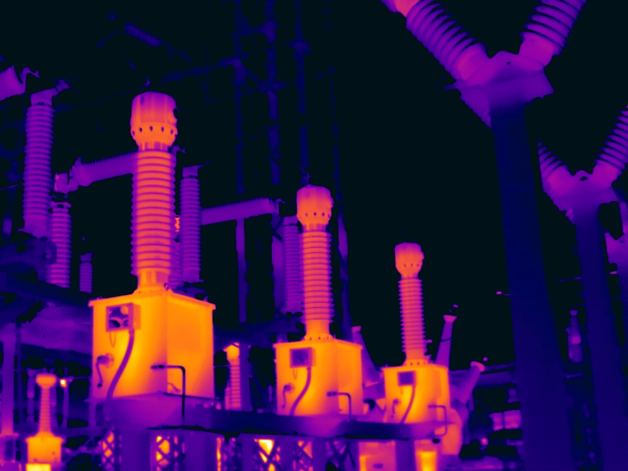 Thermal infrared scan of substation bushings showing hot spots