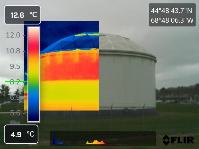FLIR thermal overlay on a storage tank showing heat gradient and fill level